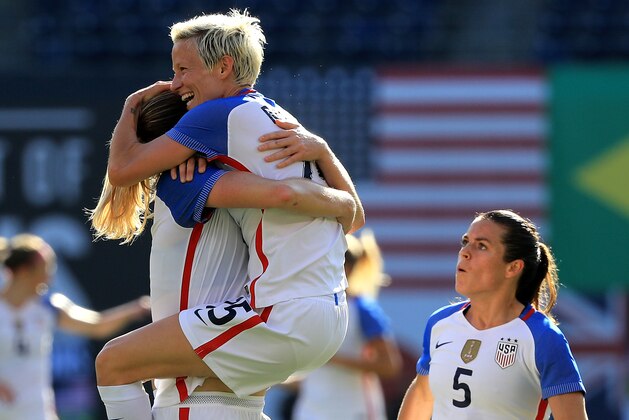 SAN DIEGO, CA - JULY 30:  Kelley O'Hara #5, Megan Rapinhoe #15, and Becky Sauerbrunn #3 of the United States celebrate a goal against Brazil during the first half of a match in the 2017 Tournament of Nations at Qualcomm Stadium on July 30, 2017 in San Diego, California.  (Photo by Sean M. Haffey/Getty Images)
