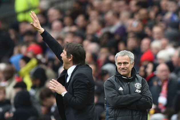 Manchester United's Portuguese manager Jose Mourinho (R) looks on as Chelsea's Italian head coach Antonio Conte (L) gestures during the English Premier League football match between Manchester United and Chelsea at Old Trafford in Manchester, north west England, on April 16, 2017. / AFP PHOTO / Oli SCARFF / RESTRICTED TO EDITORIAL USE. No use with unauthorized audio, video, data, fixture lists, club/league logos or 'live' services. Online in-match use limited to 75 images, no video emulation. No use in betting, games or single club/league/player publications.  /         (Photo credit should read OLI SCARFF/AFP/Getty Images)