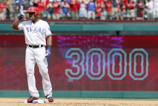Texas Rangers' Adrian Beltre tips his helmet as he acknowledges cheers after hitting a double for his 3,000th career hit that came off a pitch from Baltimore Orioles' Wade Miley in the fourth inning of a baseball game, Sunday, July 30, 2017, in Arlington, Texas. (AP Photo/Tony Gutierrez)