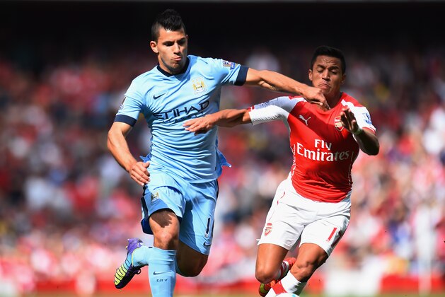 LONDON, ENGLAND - SEPTEMBER 13:  Sergio Aguero of Manchester City and Alexis Sanchez of Arsenal battle for the ball during the Barclays Premier League match between Arsenal and Manchester City at Emirates Stadium on September 13, 2014 in London, England.  (Photo by Shaun Botterill/Getty Images)