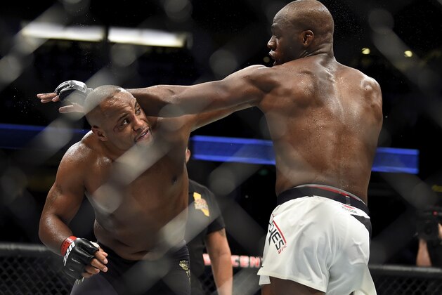 ANAHEIM, CA - JULY 29:  (L-R) Daniel Cormier punches Jon Jones in their UFC light heavyweight championship bout during the UFC 214 event inside the Honda Center on July 29, 2017 in Anaheim, California. (Photo by Jeff Bottari/Zuffa LLC/Zuffa LLC via Getty Images)