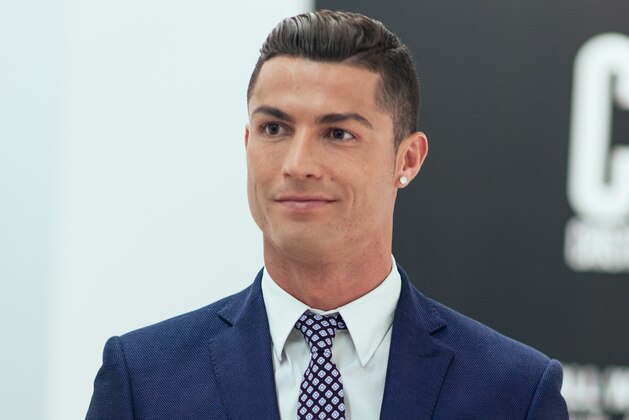 GUIMARAES, PORTUGAL - OCTOBER 5:  Cristiano Ronaldo makes his catwalk debut to model new styles at the global launch of his FW15 CR7 Footwear collection on October 5, 2015 in Guimaraes, Portugal. (Photo by CR7 Footwear via Getty images)