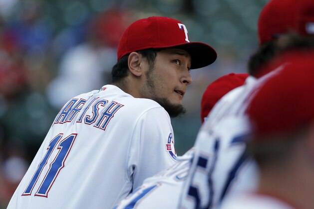 Texas Rangers' Yu Darvish, of Japan, watches play against the Baltimore Orioles in the ninth inning of a baseball game, Sunday, July 30, 2017, in Arlington, Texas. (AP Photo/Tony Gutierrez)