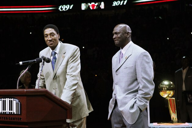 In this photo taken Saturday, March 12, 2011, former Chicago Bull Scottie Pippen, left, addresses the crowd with Michael Jordan, as teammates from their 1990-91 season celebrate the 20th anniversary of the Bulls' first NBA championship, during halftime of an NBA game against the Bulls and Utah Jazz   in Chicago. (AP Photo/Charles Rex Arbogast)