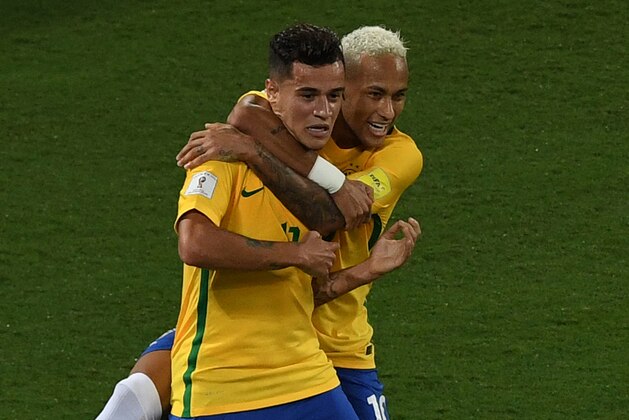 Brazil's Philippe Coutinho (L) celebrates his goal against Bolivia with teammate Neymar  during their Russia 2018 World Cup qualifier football match in Natal, Brazil, on October 6, 2016. / AFP / VANDERLEI ALMEIDA        (Photo credit should read VANDERLEI ALMEIDA/AFP/Getty Images)
