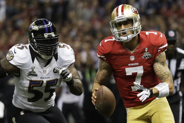 San Francisco 49ers quarterback Colin Kaepernick (7) carries the ball past Baltimore Ravens linebacker Terrell Suggs (55) during the first half of the NFL Super Bowl XLVII football game, Sunday, Feb. 3, 2013, in New Orleans. (AP Photo/Matt Slocum)