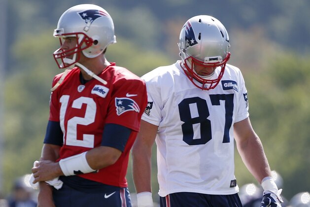 New England Patriots quarterback Tom Brady (12) and tight end Rob Gronkowski (87) on the field during NFL football training camp, Friday, July 28, 2017, in Foxborough, Mass. (AP Photo/Michael Dwyer)