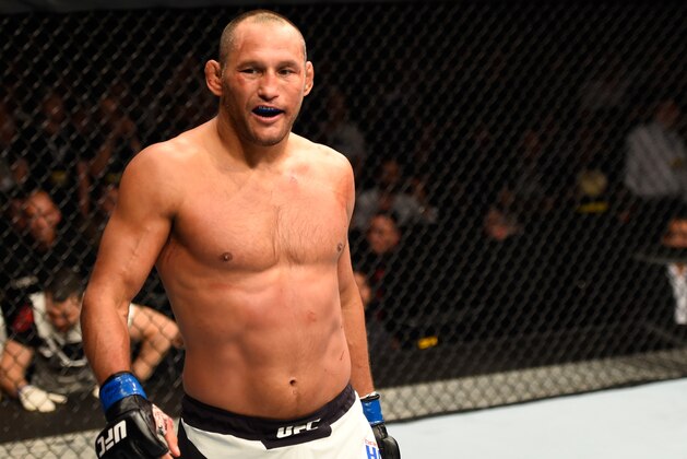 MANCHESTER, ENGLAND - OCTOBER 08:  Dan Henderson smiles while facing Michael Bisping of England in their UFC middleweight championship bout during the UFC 204 Fight Night at the Manchester Evening News Arena on October 8, 2016 in Manchester, England. (Photo by Josh Hedges/Zuffa LLC/Zuffa LLC via Getty Images)