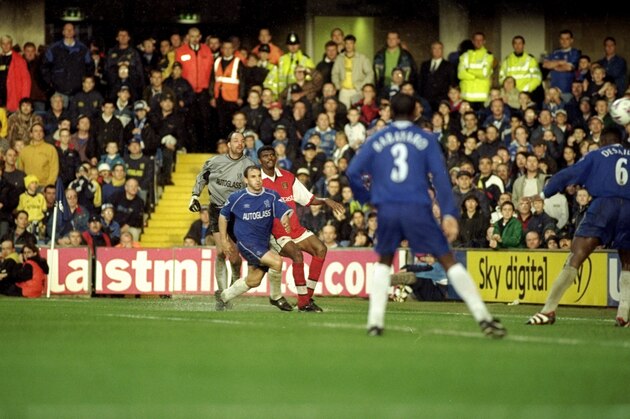23 Oct 1999:  Nwankwo Kanu of Arsenal scores a dramatic 90th minute winning goal from an acute angle during the FA Carling Premier League match against Chelsea played at Stamford Bridge, London. The game finished in 3-2 win for Arsenal.  \ Mandatory Credit: Graham Chadwick /Allsport