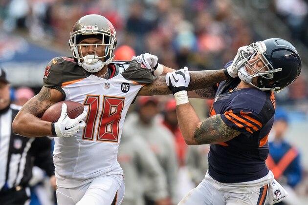 CHICAGO, IL - NOVEMBER 23:  Wide receiver Louis Murphy #18 of the Tampa Bay Buccaneers carries for 54 yards but receives a penalty for holding onto the face mask of Chris Conte #47 of the Chicago Bears in the second quarter at Soldier Field on November 23, 2014 in Chicago, Illinois.  (Photo by Brian Kersey/Getty Images)