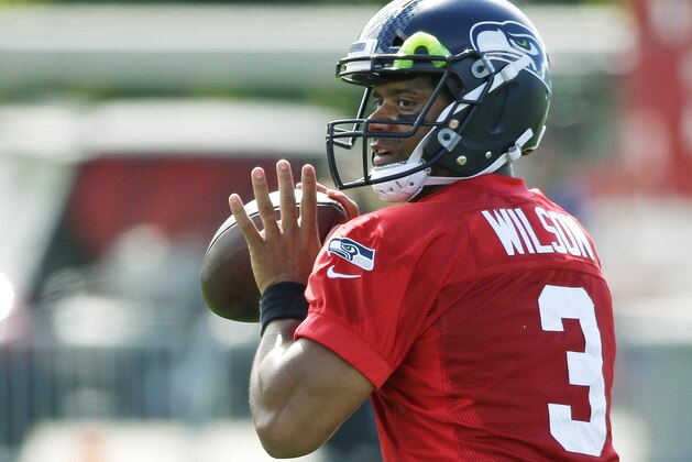 Seattle Seahawks quarterback Russell Wilson passes during an NFL football training camp, Sunday, July 30, 2017, in Renton, Wash. (AP Photo/Ted S. Warren)