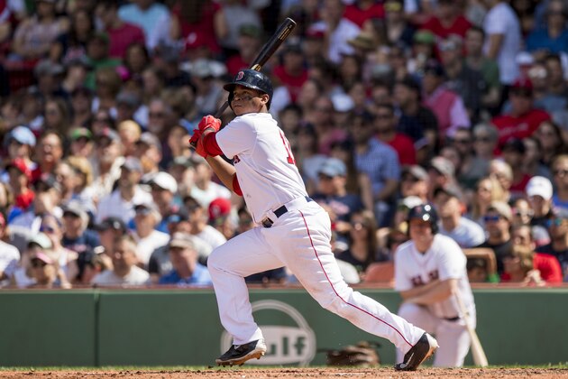 BOSTON, MA - JULY 30: Rafael Devers #11 of the Boston Red Sox hits a solo home run during the fifth inning of a game against the Kansas City Royals on July 30, 2017 at Fenway Park in Boston, Massachusetts. (Photo by Billie Weiss/Boston Red Sox/Getty Images)