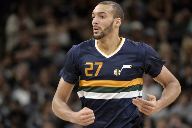 Utah Jazz center Rudy Gobert runs upcourt during the first half of an NBA basketball game against the San Antonio Spurs, Sunday, April 2, 2017, in San Antonio. San Antonio won 109-103. (AP Photo/Darren Abate)