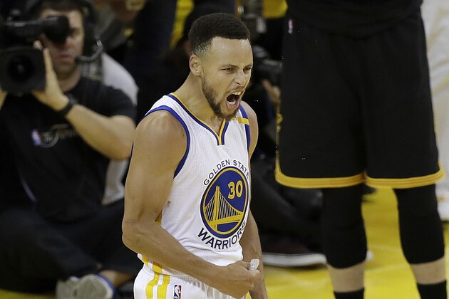 Golden State Warriors guard Stephen Curry (30) reacts after scoring against the Cleveland Cavaliers during the second half of Game 2 of basketball's NBA Finals in Oakland, Calif., Sunday, June 4, 2017. (AP Photo/Marcio Jose Sanchez)