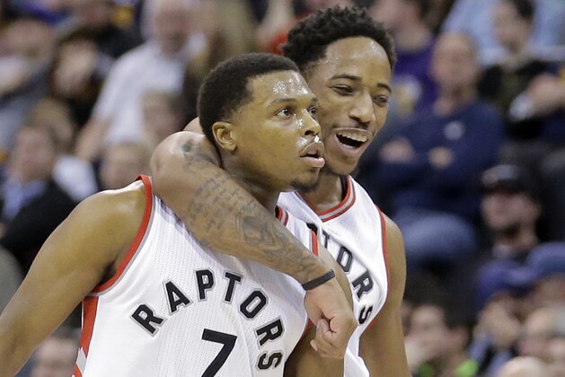 FILE - In this Friday, Dec. 23, 2016, file photo, Toronto Raptors' Kyle Lowry (7) celebrates with teammate DeMar DeRozan (10) after scoring in the second half during an NBA basketball game against the Utah Jazz in Salt Lake City. Name the only team in the NBA to not lose a game by double digits this season.Golden State? Nope. San Antonio? Wrong. Cleveland? Incorrect. It's the Raptors, who very quietly have stayed right in the Cavaliers' rearview mirror in the Eastern Conference and look like a club that has the potential for another deep playoff run. (AP Photo/Rick Bowmer, File)