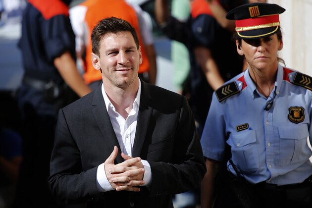 FILE - In this Sept. 27, 2013 file photo, FC Barcelona soccer player Lionel Messi, left, arrives at a court to answer questions in a tax fraud case in Gava, near Barcelona, Spain. Lionel Messi has lost his Supreme Court appeal over a tax-fraud conviction in Spain. The court has confirmed on Wednesday May 24, 2017, the 21-month prison sentence handed to Messi for defrauding tax authorities of 4.1 million euros from 2007-09. He is not expected to go to prison because sentences of less than two years for first offences are usually suspended in Spain. (AP Photo/Emilio Morenatti, File)