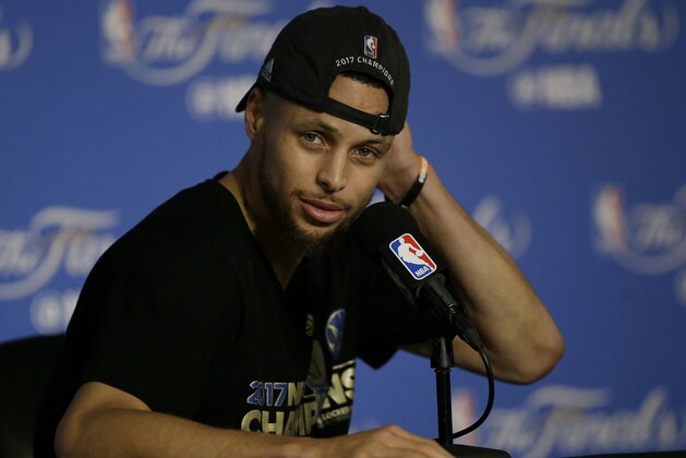 Golden State Warriors guard Stephen Curry speaks at a news conference after Game 5 of basketball's NBA Finals between the Warriors and the Cleveland Cavaliers in Oakland, Calif., Monday, June 12, 2017. The Warriors won 129-120 to win the NBA championship. (AP Photo/Ben Margot)