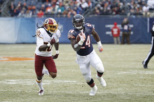 CHICAGO, IL - DECEMBER 24: Jordan Howard #24 of the Chicago Bears runs the ball while chased by Greg Toler #20 of the Washington Redskins during the game at Soldier Field on December 24, 2016 in Chicago, Illinois. Washington defeated Chicago 41-21. (Photo by Joe Robbins/Getty Images)