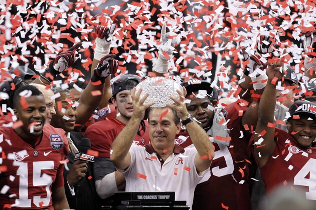 FILE - In this Jan. 9, 2012, file photo, Alabama head coach Nick Saban celebrates with his team after the BCS National Championship college football game against LSU, in New Orleans. Alabama won 21-0. The beginning of the decade, and of a dynasty.  The Crimson Tide has been unquestionably the dominant team of the decade to this point, riding Saban's