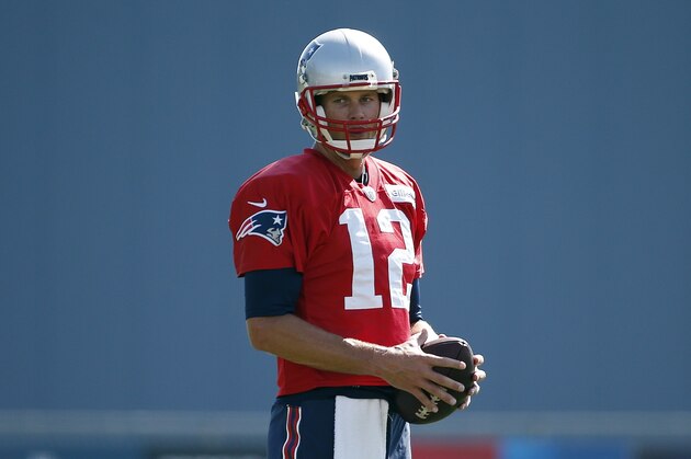 New England Patriots quarterback Tom Brady (12) on the field during NFL football training camp, Friday, July 28, 2017, in Foxborough, Mass. (AP Photo/Michael Dwyer)