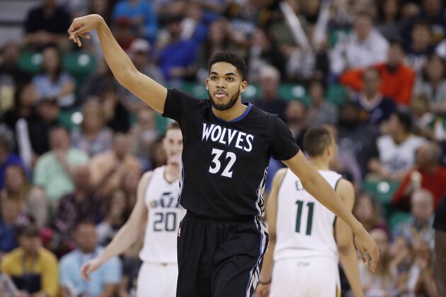 Apr 7, 2017; Salt Lake City, UT, USA; Minnesota Timberwolves center Karl-Anthony Towns (32) reacts to a third quarter three-pointer in the third quarter against the Utah Jazz at Vivint Smart Home Arena. Utah Jazz defeated Minnesota Timberwolves 120-13. Mandatory Credit: Jeff Swinger-USA TODAY Sports