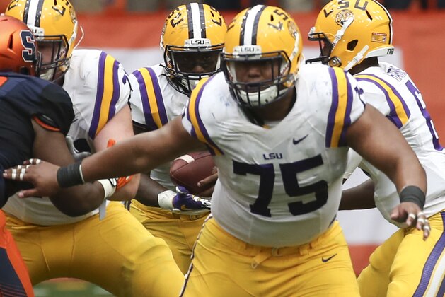 LSU guard Maea Teuhema (75) looks to block during the second half of an NCAA college football game against Syracuse on Saturday, Sept. 26, 2015, in Syracuse, N.Y. (AP Photo/Mike Groll)