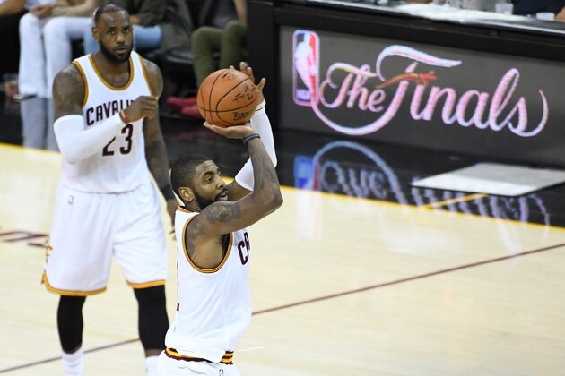 June 9, 2017; Cleveland, OH, USA; Cleveland Cavaliers guard Kyrie Irving (2) shoots the basketball in front of forward LeBron James (23) during the third quarter in game four of the 2017 NBA Finals against the Golden State Warriors at Quicken Loans Arena. Mandatory Credit: Kyle Terada-USA TODAY Sports