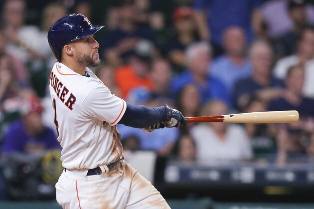 HOUSTON, TX - JULY 17:  George Springer #4 of the Houston Astros hits a sacrifice fly in the eighth inning against the Seattle Mariners at Minute Maid Park on July 17, 2017 in Houston, Texas.  (Photo by Bob Levey/Getty Images)