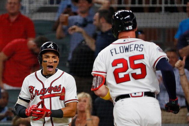 ATLANTA, GA - AUGUST 02:  Johan Camargo #17 of the Atlanta Braves reacts after scoring on a two-run homer hit by Tyler Flowers #25 in the eighth inning against the Los Angeles Dodgers at SunTrust Park on August 2, 2017 in Atlanta, Georgia.  (Photo by Kevin C. Cox/Getty Images)