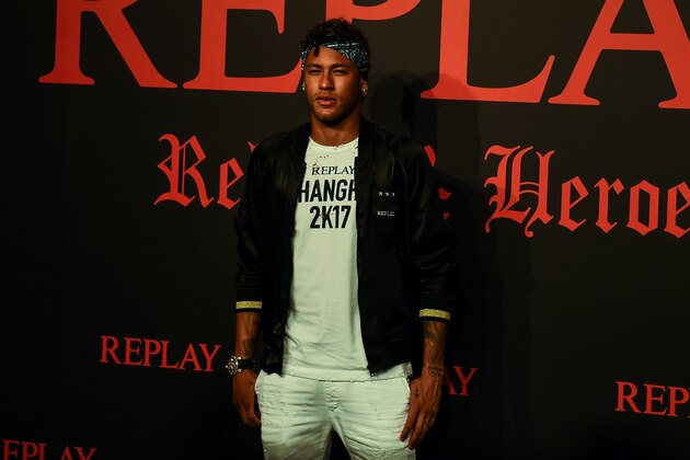 Brazilian footballer Neymar Jr. poses for a photograph during a fashion event in Shanghai on July 31, 2017.
Neymar hit the red carpet in Shanghai on July 31 as speculation mounted that the Brazil star could be set to quit Barcelona for Paris Saint-Germain for a world-record 222 million euros. / AFP PHOTO / CHANDAN KHANNA (Photo credit should read CHANDAN KHANNA/AFP/Getty Images) Brazilian footballer Neymar Jr. poses for a photograph during a fashion event in Shanghai on July 31, 2017.
Neymar hit the red carpet in Shanghai on July 31 as speculation mounted that the Brazil star could be set to quit Barcelona for Paris Saint-Germain for a world-record 222 million euros. / AFP PHOTO / CHANDAN KHANNA (Photo credit should read CHANDAN KHANNA/AFP/Getty Images)