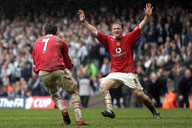 Manchester United's Cristiano Ronaldo, left, celebrates with teammate Wayne Rooney after Ronaldo scored his side's fourth goal against Newcastle during their English FA Cup semi final soccer match at the Millennium Stadium, Cardiff, Wales, Sunday, April 17, 2005. Manchester United won the game 4-1. (AP Photo/Jon Super).