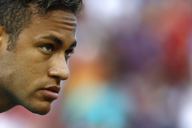 Barcelona's Neymar walks on the field before an International Champions Cup soccer match against Manchester United, Wednesday, July 26, 2017, in Landover, Md. (AP Photo/Patrick Semansky)