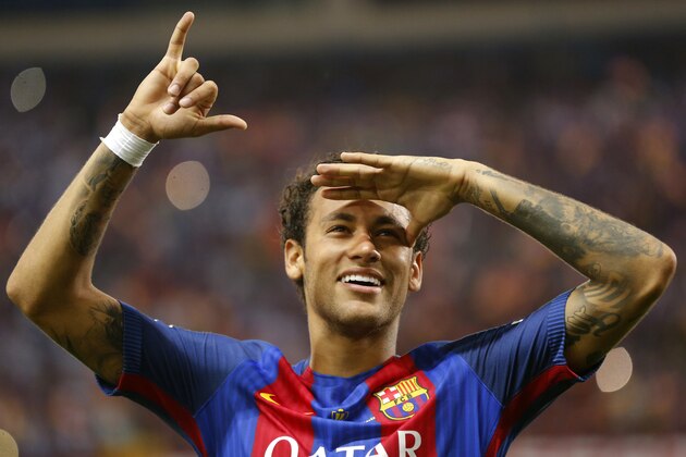 Barcelona's Neymar celebrates at the end of the Copa del Rey final soccer match between Barcelona and Alaves at the Vicente Calderon stadium in Madrid, Spain, Saturday May 27, 2017. (AP Photo/Daniel Ochoa de Olza)