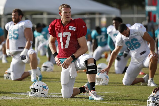 Miami Dolphins quarterback Ryan Tannehill stretches out during an NFL football training camp, Thursday, Aug. 3, 2017 at the Dolphins training facility in Davie, Fla. (AP Photo/Wilfredo Lee)