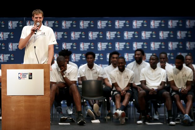 Basketball player Dirk Nowitzki of the Dallas Mavericks speaks during the media conference for Basketball without Borders Africa, the NBA and FIBA's global basketball development and community outreach program, at the American International School of Johannesburg, in South Africa, Wednesday, Aug. 2, 2017. (AP Photo/Themba Hadebe)