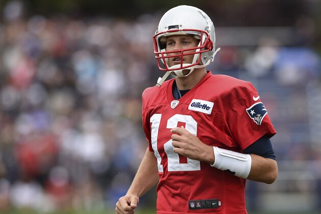 Jul 27, 2017; Foxborough, MA, USA; New England Patriots quarterback Tom Brady (12) runs on to the field during training camp at Gillette Stadium. Mandatory Credit: Bob DeChiara-USA TODAY Sports