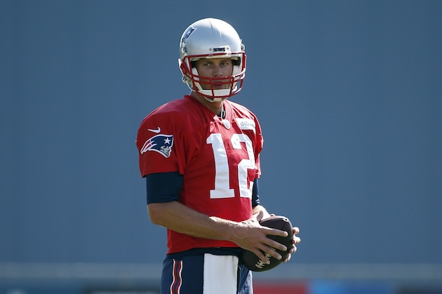 New England Patriots quarterback Tom Brady (12) on the field during NFL football training camp, Friday, July 28, 2017, in Foxborough, Mass. (AP Photo/Michael Dwyer)