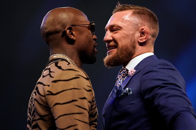 LONDON, ENGLAND - JULY 14:  (R-L) Conor McGregor and Floyd Mayweather Jr. face off during the Floyd Mayweather Jr. v Conor McGregor World Press Tour event at SSE Arena on July 14, 2017 in London, England. (Photo by Jeff Bottari/Zuffa LLC/Zuffa LLC via Getty Images)