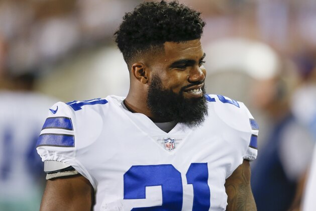 Dallas Cowboys running back Ezekiel Elliott (21) smiles on the sideling during the first half of the Pro Football Hall of Fame NFL preseason game against the Arizona Cardinals in Canton, Ohio, Thursday, Aug. 3, 2017. (AP Photo/Ron Schwane)