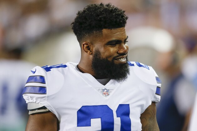 Dallas Cowboys running back Ezekiel Elliott (21) smiles on the sideling during the first half of the Pro Football Hall of Fame NFL preseason game against the Arizona Cardinals in Canton, Ohio, Thursday, Aug. 3, 2017. (AP Photo/Ron Schwane)