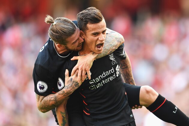 LONDON, ENGLAND - AUGUST 14:  Philippe Coutinho of Liverpool celebrates scoring his free kick with Alberto Moreno during the Premier League match between Arsenal and Liverpool at Emirates Stadium on August 14, 2016 in London, England.  (Photo by Mike Hewitt/Getty Images)