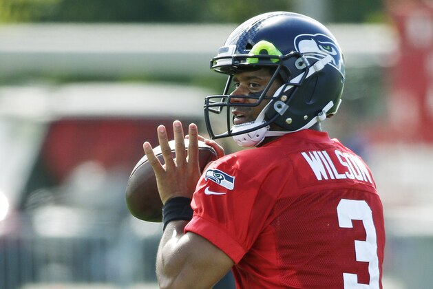 Seattle Seahawks quarterback Russell Wilson passes during an NFL football training camp, Sunday, July 30, 2017, in Renton, Wash. (AP Photo/Ted S. Warren) Seattle Seahawks quarterback Russell Wilson passes during an NFL football training camp, Sunday, July 30, 2017, in Renton, Wash. (AP Photo/Ted S. Warren)