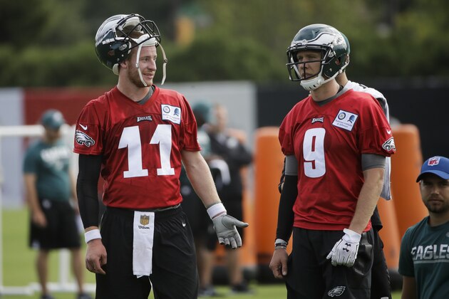 Philadelphia Eagles quarterback Carson Wentz (11) and quarterback Nick Foles (9) during an NFL football training camp in Philadelphia, Monday, July 24, 2017. (AP Photo/Matt Rourke)