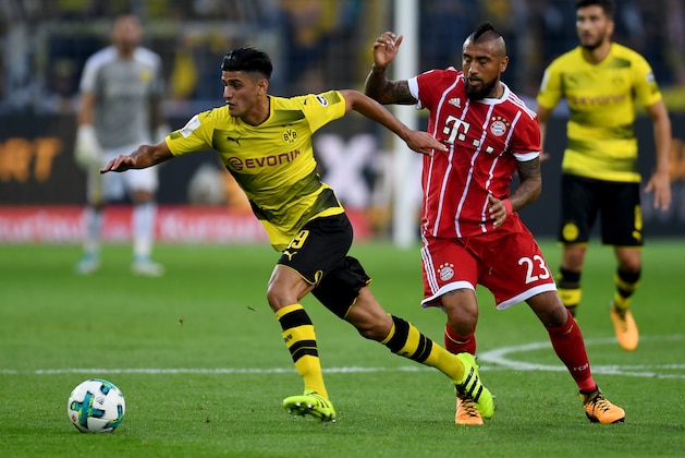 Bayern Munich's Chilean midfielder Arturo Vidal (R) and Dortmund's midfielder Mahmoud Dahoud vie for the ball during the German Supercup football match between Borussia Dortmund vs Bayern Munich in Dortmund, western Germany, on August 5, 2017. / AFP PHOTO / PATRIK STOLLARZ        (Photo credit should read PATRIK STOLLARZ/AFP/Getty Images)