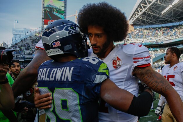 SEATTLE, WA - SEPTEMBER 25:  Quarterback Colin Kaepernick #7 of the San Francisco 49ers talks with wide receiver Doug Baldwin #89 of the Seattle Seahawks after the game at CenturyLink Field on September 25, 2016 in Seattle, Washington.  (Photo by Otto Greule Jr/Getty Images)