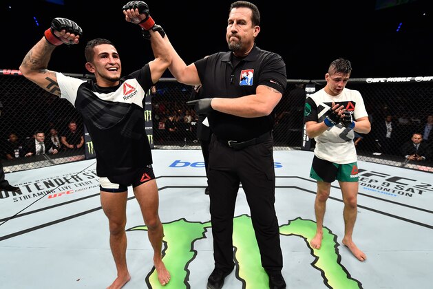 MEXICO CITY, MEXICO - AUGUST 05:  (L-R) Sergio Pettis celebrates his victory over Brandon Moreno of Mexico in their flyweight bout during the UFC Fight Night event at Arena Ciudad de Mexico on August 5, 2017 in Mexico City, Mexico. (Photo by Jeff Bottari/Zuffa LLC/Zuffa LLC via Getty Images)