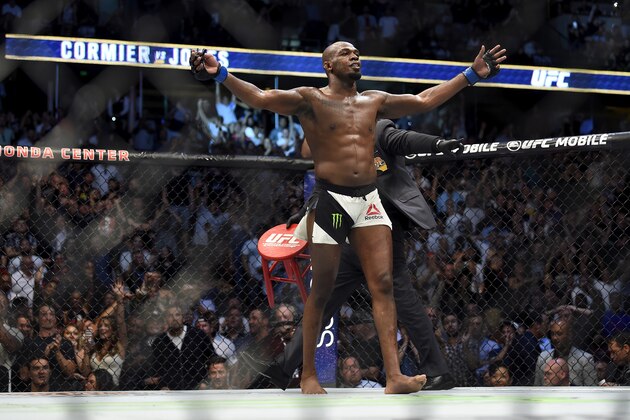 ANAHEIM, CA - JULY 29:  Jon Jones celebrates after defeating Daniel Cormier in their UFC light heavyweight championship bout during the UFC 214 event inside the Honda Center on July 29, 2017 in Anaheim, California. (Photo by Jeff Bottari/Zuffa LLC/Zuffa LLC via Getty Images)