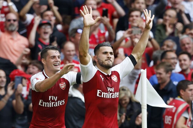 Arsenal's German-born Bosnian defender Sead Kolasinac (R) celebrates with Arsenal's Swiss midfielder Granit Xhaka, scoring the team's first goal during the English FA Community Shield football match between Arsenal and Chelsea at Wembley Stadium in north London on August 6, 2017. / AFP PHOTO / Ian KINGTON / NOT FOR MARKETING OR ADVERTISING USE / RESTRICTED TO EDITORIAL USE        (Photo credit should read IAN KINGTON/AFP/Getty Images)