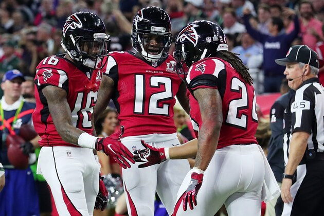 HOUSTON, TX - FEBRUARY 05:  Justin Hardy #16, Mohamed Sanu #12 and Devonta Freeman #24 of the Atlanta Falcons celebrate  after Freeman scored a touchdown on a 5 yard run against the New England Patriots in the second quarter during Super Bowl 51 at NRG Stadium on February 5, 2017 in Houston, Texas.  (Photo by Tom Pennington/Getty Images)