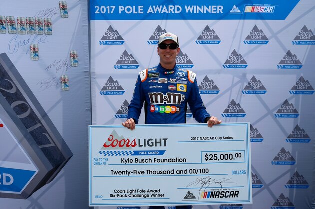 WATKINS GLEN, NY - AUGUST 06:  Kyle Busch, driver of the #18 M&M's Caramel Toyota, poses for a photo after winning the pole award during qualifying for the Monster Energy NASCAR Cup Series I Love NY 355 at The Glen at Watkins Glen International on August 6, 2017 in Watkins Glen, New York.  (Photo by Jonathan Ferrey/Getty Images)